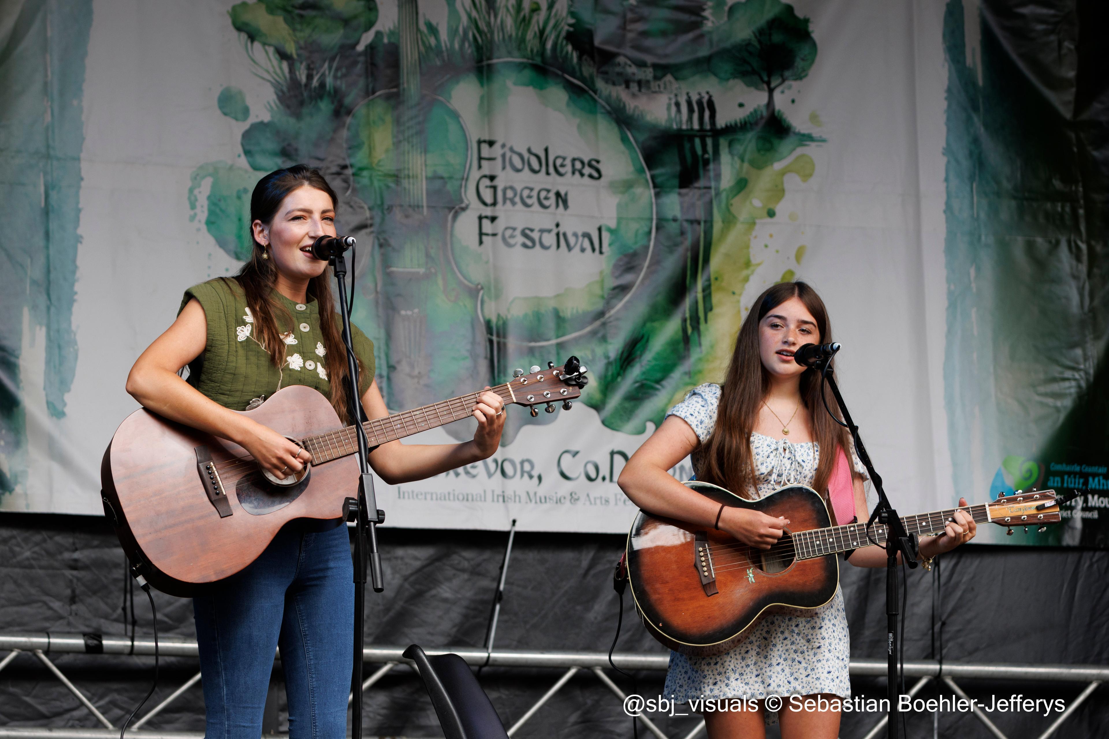 Ava Turnbull performing on stage with Catherine McGrath